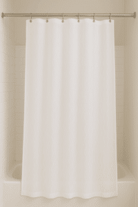 clean white shower curtain hanging in a bathroom after being washed