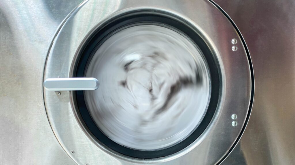 Washing machine filled with water and ozone bubbles cleaning clothes
