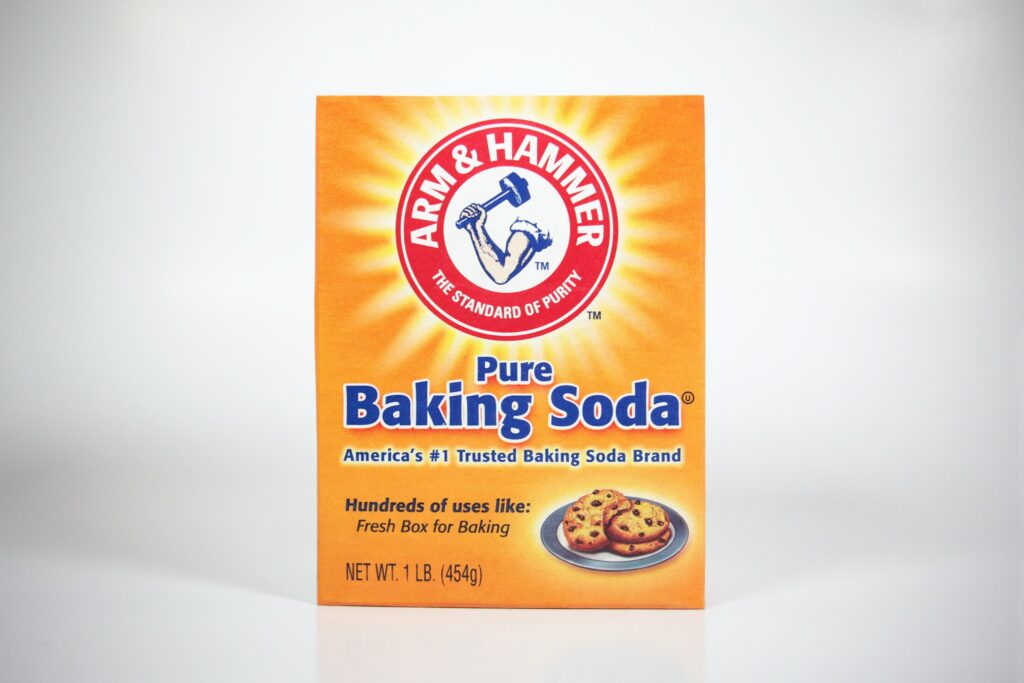  A box of Arm & Hammer baking soda on a plain white background
