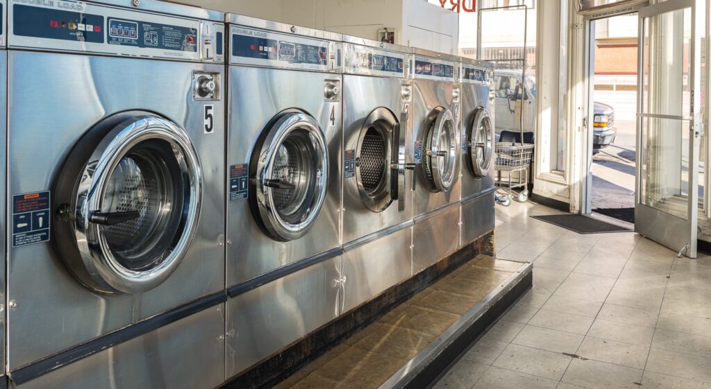 Modern front-load washing machines in a laundromat setting