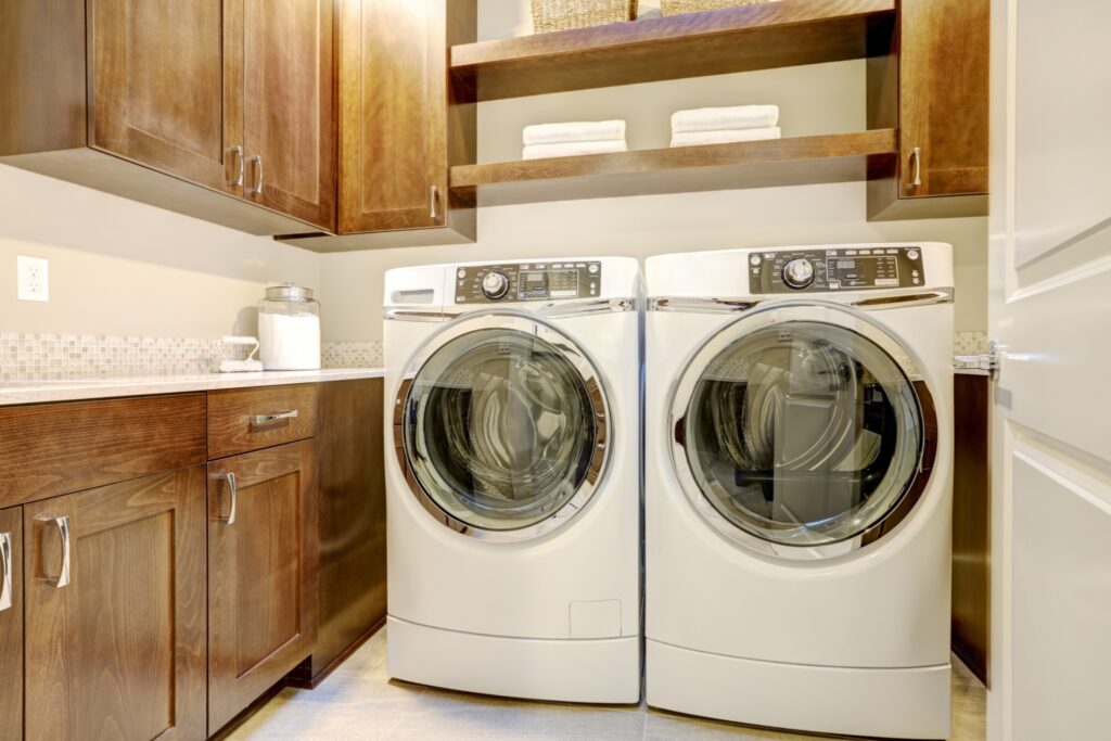 Built in cabinets above a washer and dryer