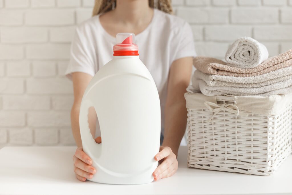 laundry-detergent-bottle-next-to-towels
