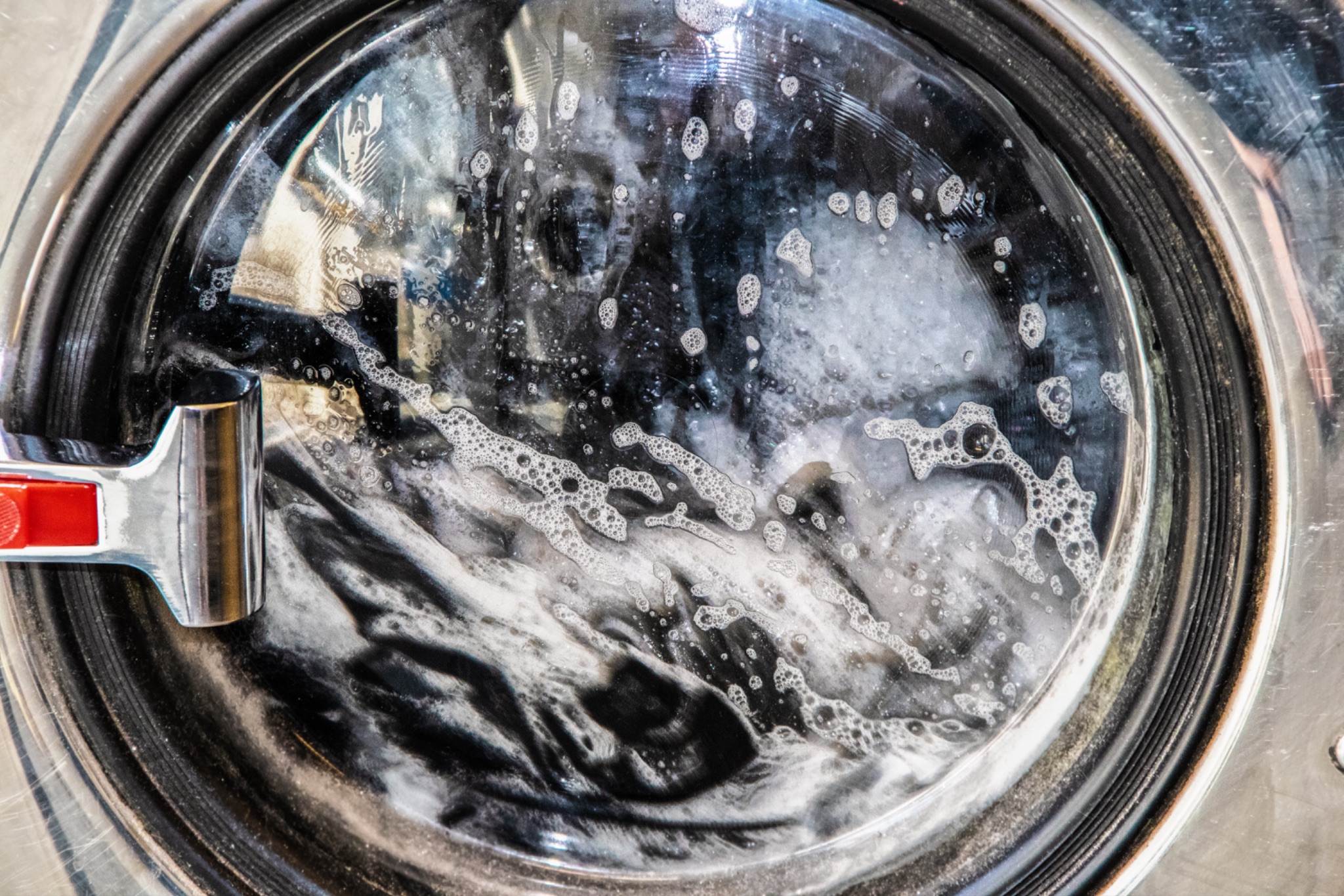 Washing machine with soapy water inside