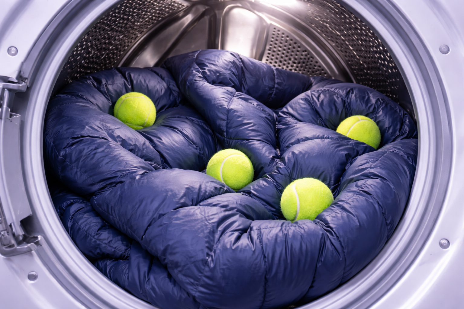 Tennis balls in dryer with blanket