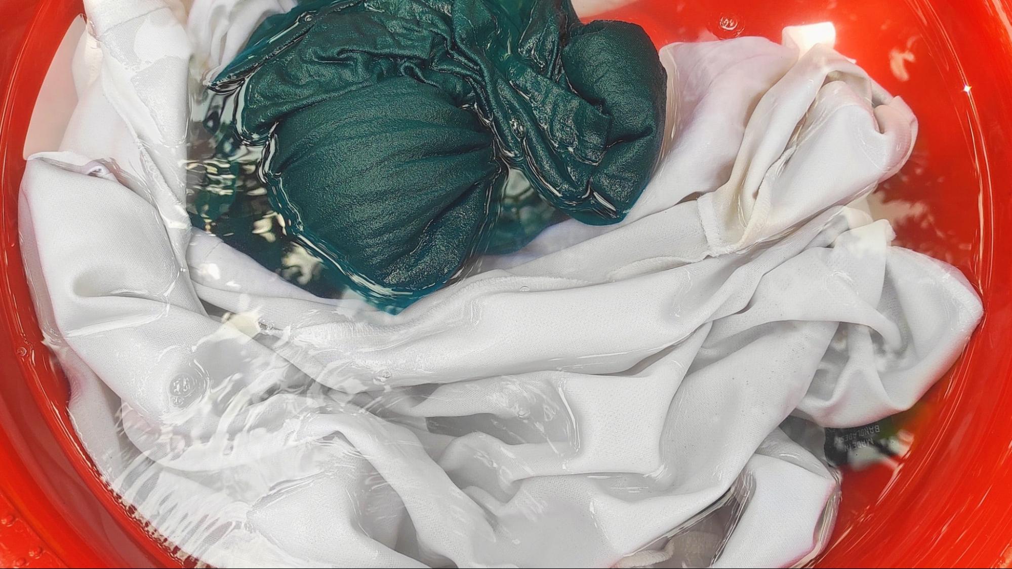 White and green clothes soaking in water